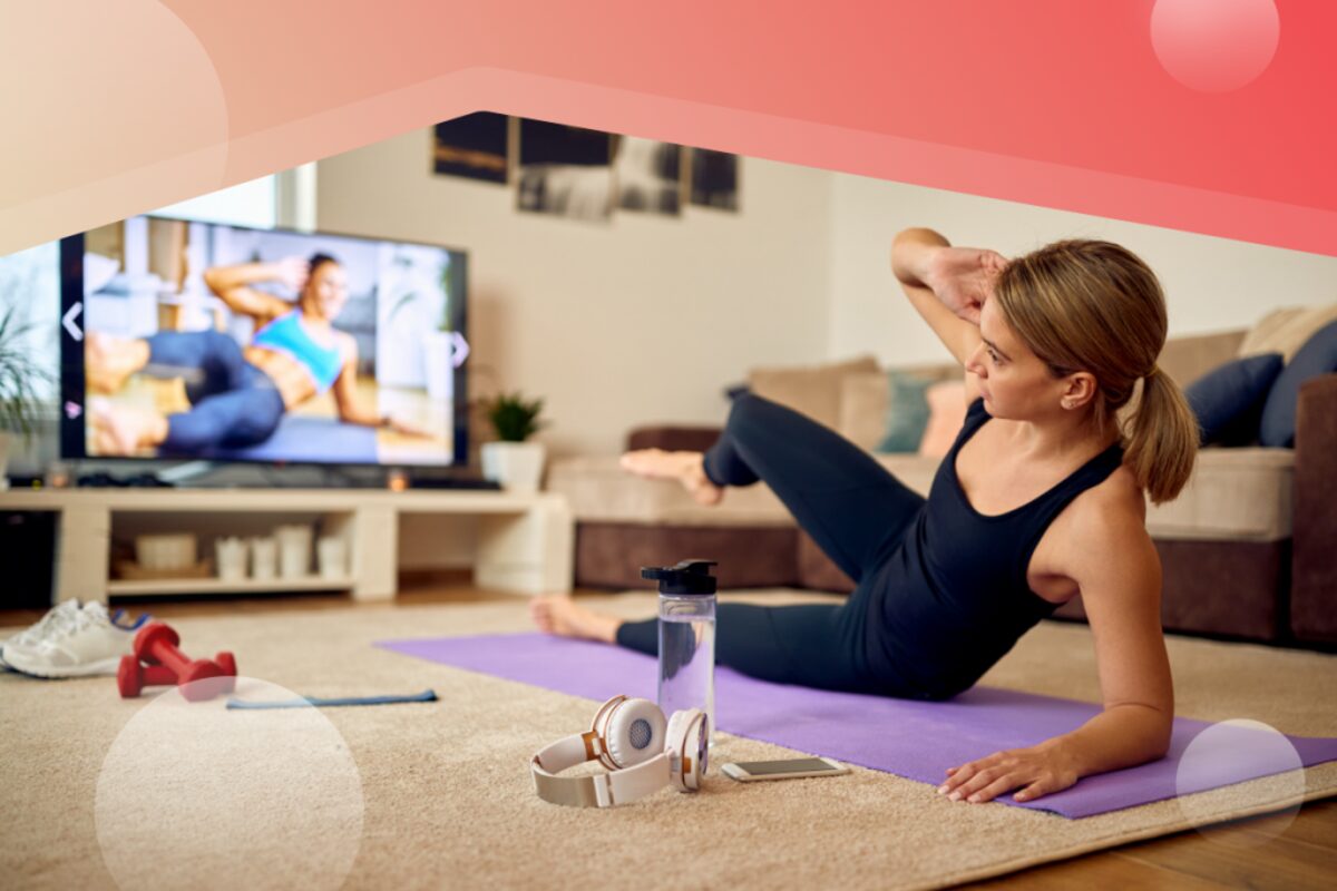 A member working out at home with The Well on screen